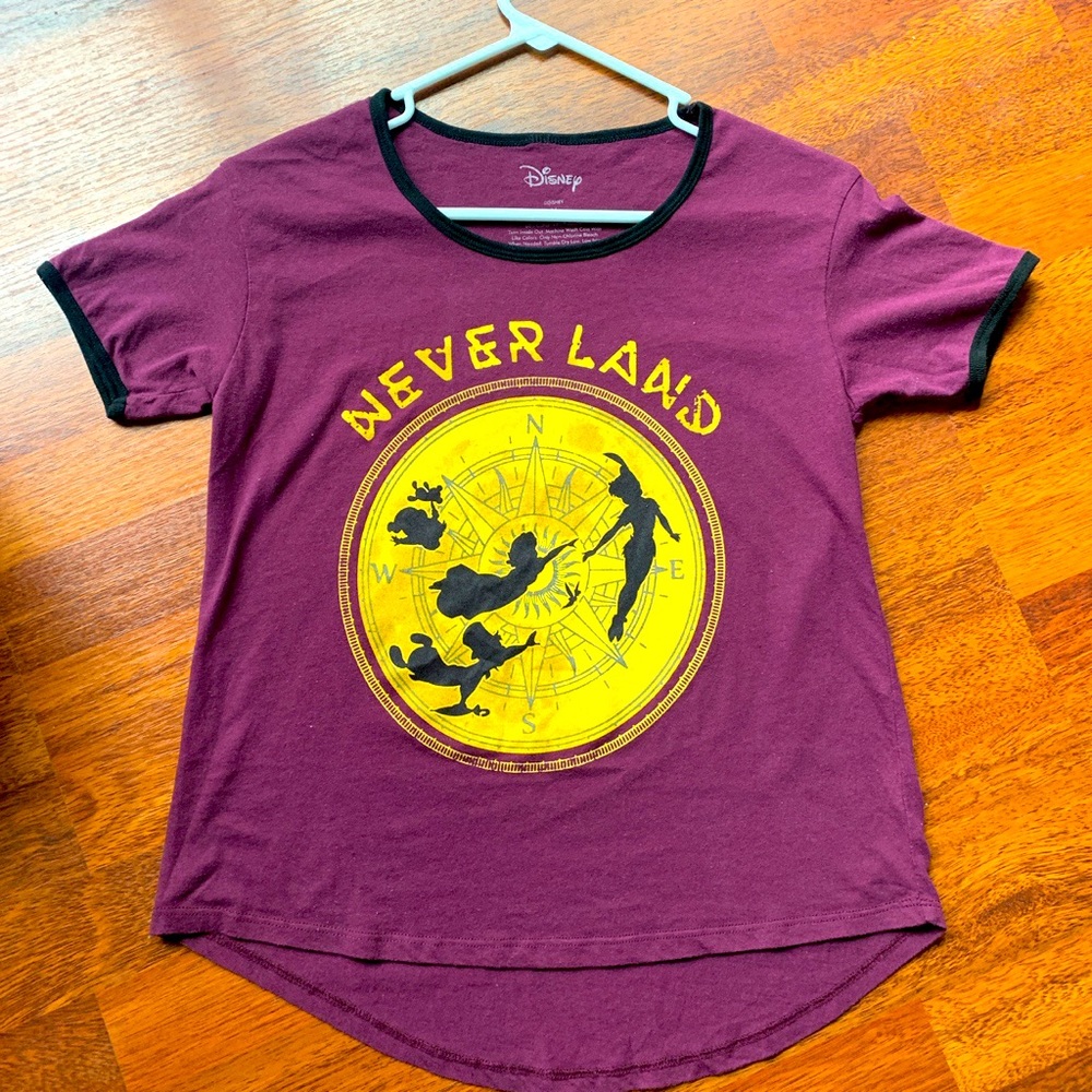 •A purple and gold neverland tee